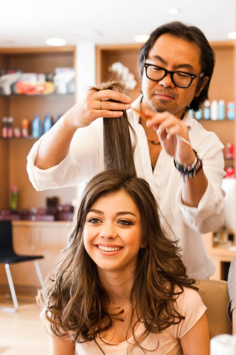 Yoshi styling Sarah Hyland's hair in the studio